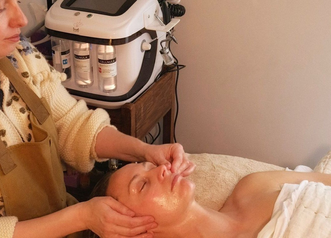 Therapist performs facial treatment at Spell Holistic, Saint Leonards, England, GB.