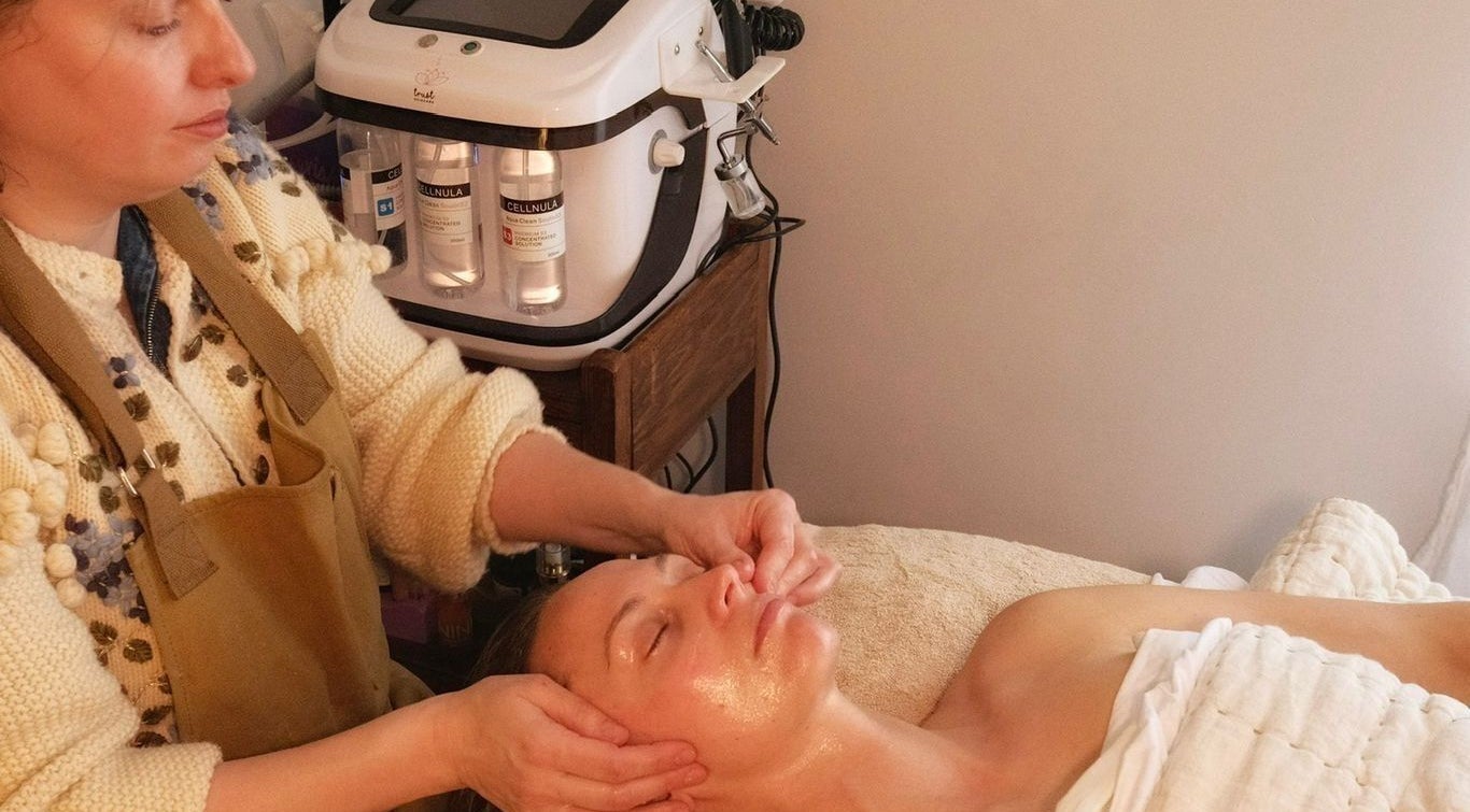 Therapist performs facial treatment at Spell Holistic, Saint Leonards, England, GB.