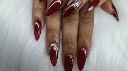 Elegant burgundy nails with glitter detail at Nailée ~ maison des ongles, Victoria, SC.