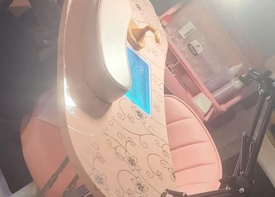 Pink nail station at The Nail Crypt, Thunder Bay, Ontario, CA showing stylish decor and ambient lighting.