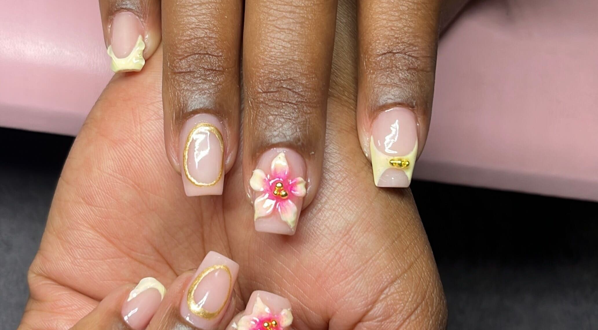 Decorated nails with pink flower design at The Kee Effect, Boksburg, Gauteng, ZA.