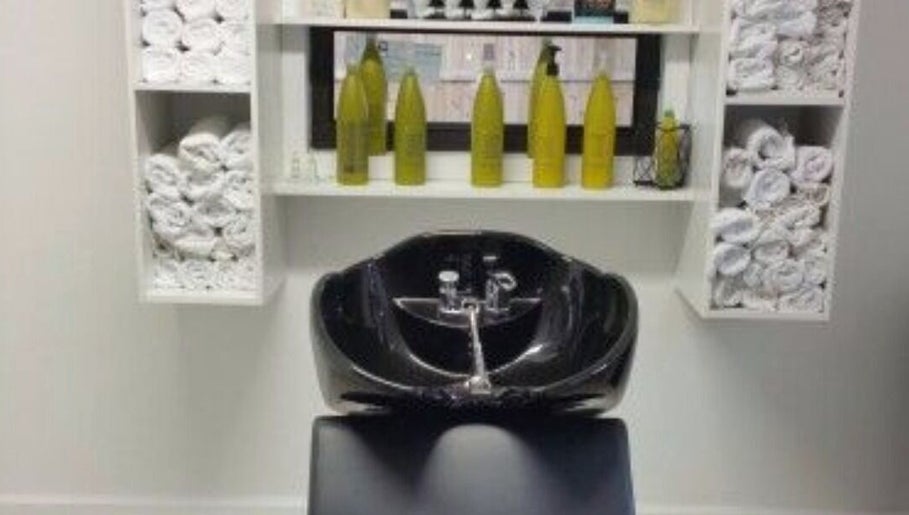 Modern wash station at Sandra Trejos Marin in Melbourne, Victoria, AU, featuring sleek black basin.