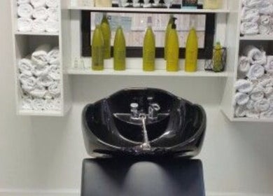 Modern wash station at Sandra Trejos Marin in Melbourne, Victoria, AU, featuring sleek black basin.