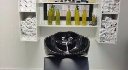Modern wash station at Sandra Trejos Marin in Melbourne, Victoria, AU, featuring sleek black basin.