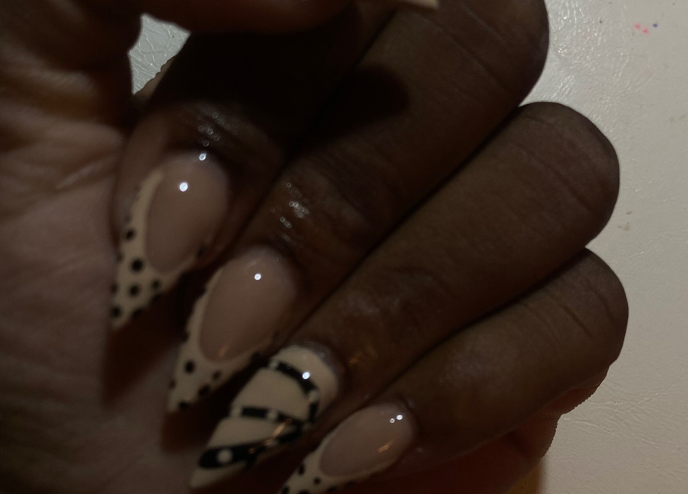 Elegant nail design featuring polka dots at Nailedbyjazz, Freeport, Freeport, BS.