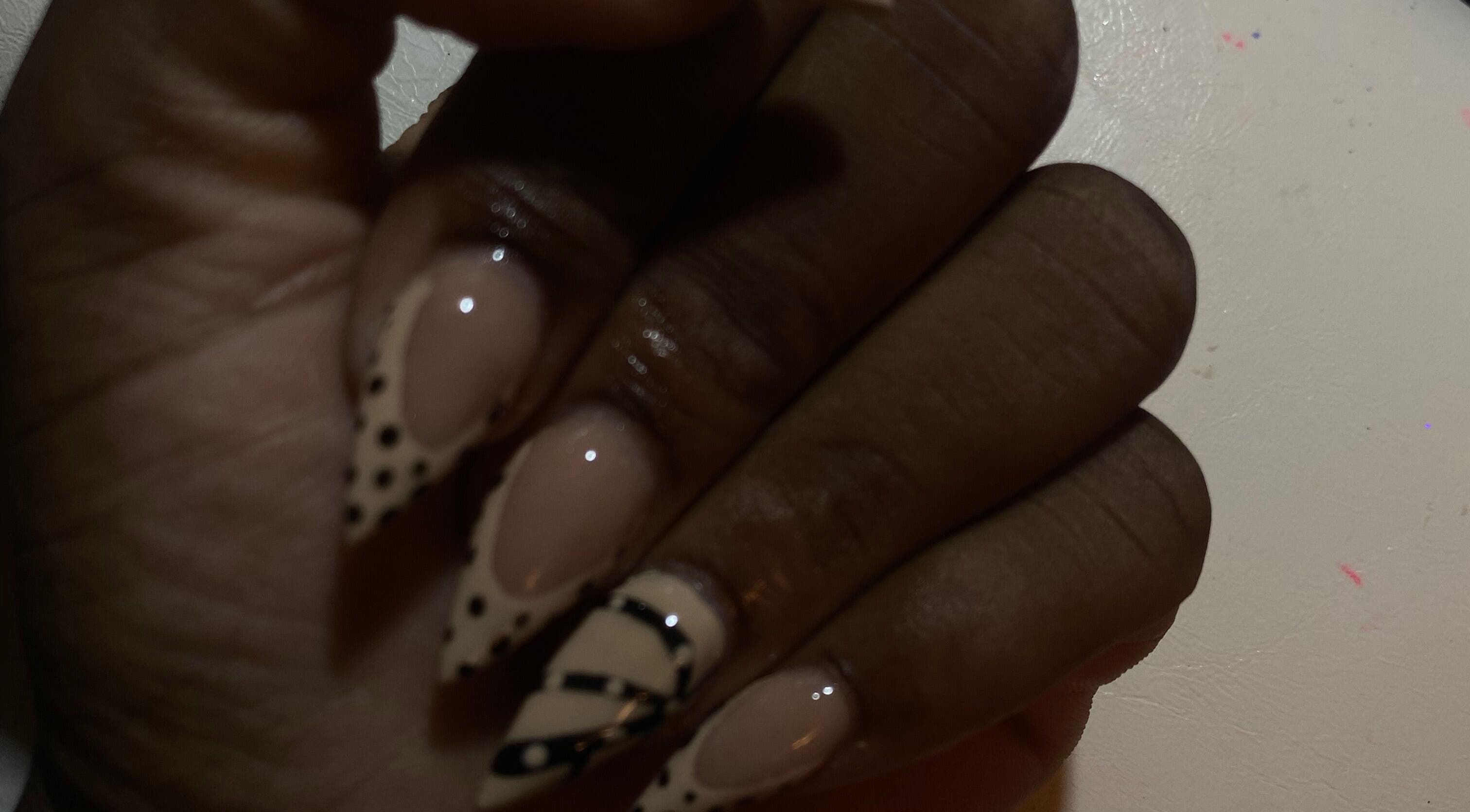 Elegant nail design featuring polka dots at Nailedbyjazz, Freeport, Freeport, BS.