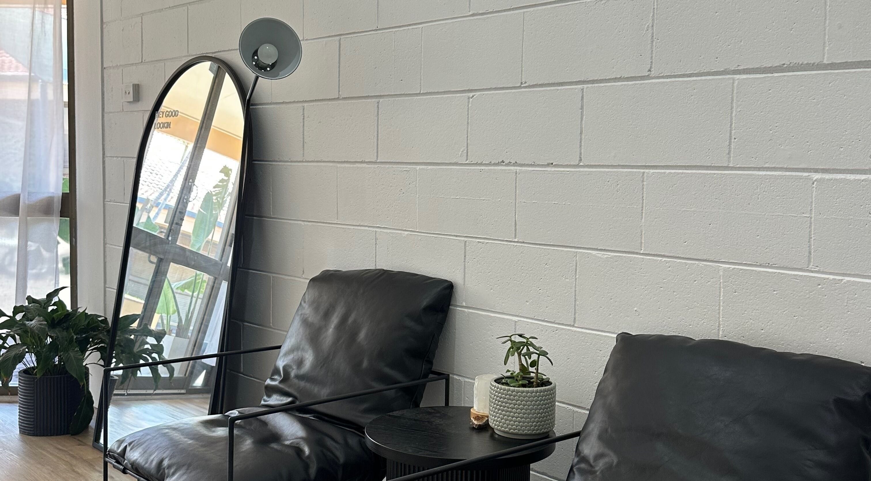 Relaxing lounge area with plants at The Beauty Collective in Ballina, New South Wales, AU.
