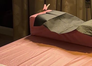 Relaxing treatment bed at The Lash Fairy, Katowice, Województwo Śląskie, PL with soft pink and gray tones.