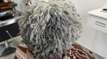 Gray curly hair styled at TMP’s Hair Care in Paramaribo, Paramaribo, SR salon.