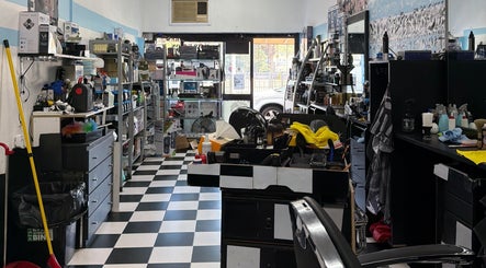 Interior of FirstclassBarbersSyd, a stylish barbershop in Fairfield, New South Wales, AU with modern decor.