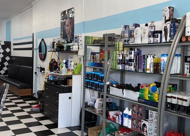 Sleek interior of FirstclassBarbersSyd, Fairfield, New South Wales, AU, showcasing professional barber supplies.