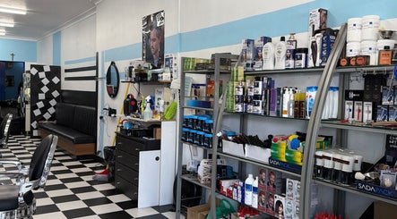 Sleek interior of FirstclassBarbersSyd, Fairfield, New South Wales, AU, showcasing professional barber supplies.