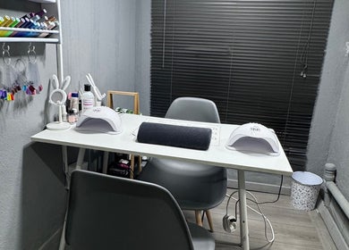 Modern nail station at Taylored Nails, Mbombela, Mpumalanga, ZA, featuring stylish decor and nail tools.