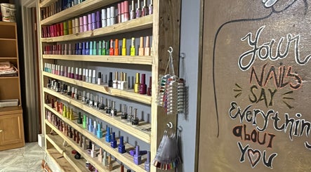 Colorful nail polish display at Taylored Nails, Mbombela, Mpumalanga, ZA, showcasing extensive selection.