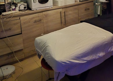Relaxing treatment room at Seasom Spa, Lekki, Lagos, NG with massage table and warm lighting.
