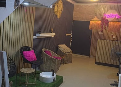 Welcoming interior of Seasom Spa in Lekki, Lagos, NG featuring cozy seating and warm lighting.