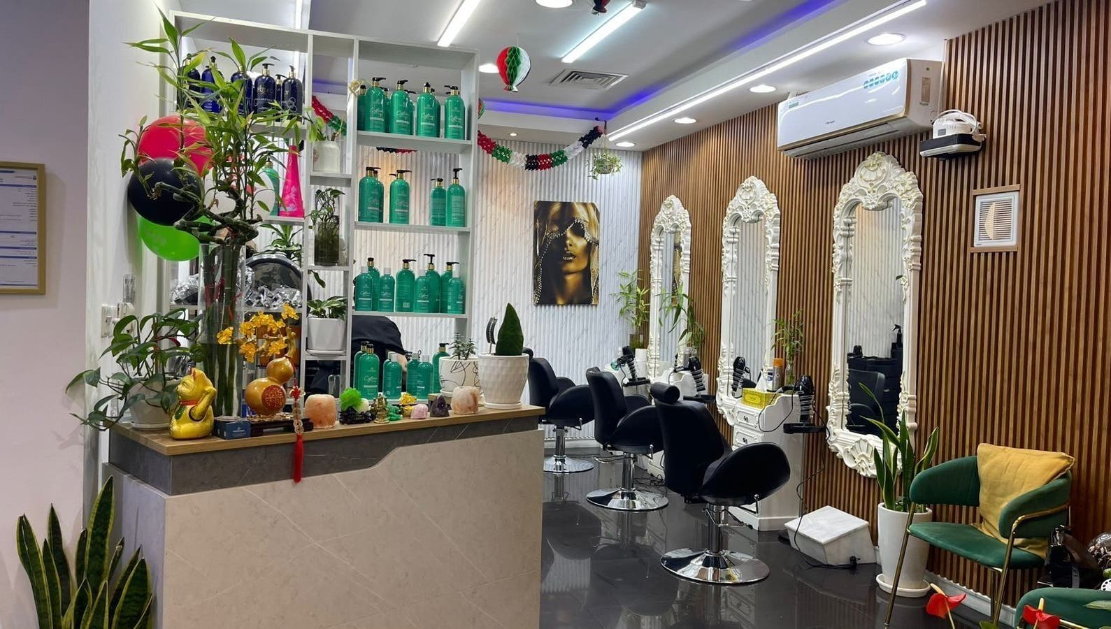 Chic interior of Beauty Garden Lady Salon, Abu Dhabi, AE with styling chairs and ornate mirrors.