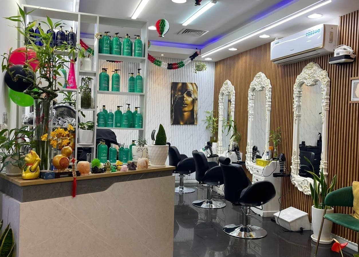 Chic interior of Beauty Garden Lady Salon, Abu Dhabi, AE with styling chairs and ornate mirrors.