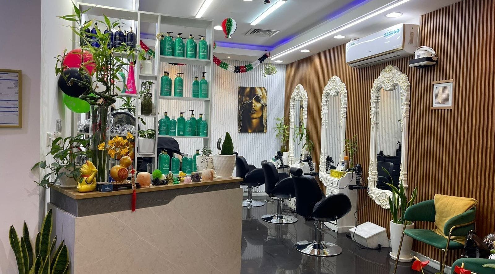 Chic interior of Beauty Garden Lady Salon, Abu Dhabi, AE with styling chairs and ornate mirrors.
