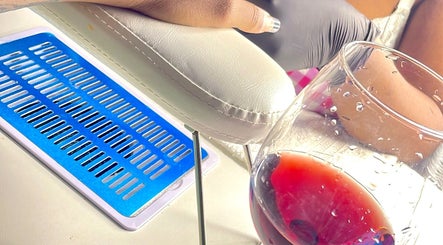 Manicure at Nya_nailluxury in Bridgetown, Saint Michael, BB, with wine and armrest view.