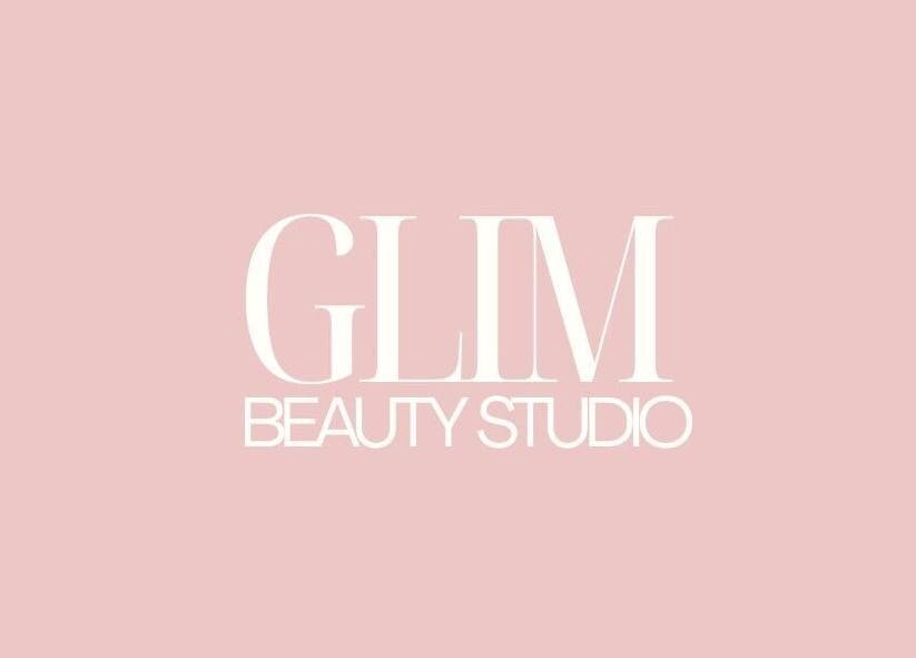 Logo of GLIM Beauty Studio in Chelmsford, England, GB featuring elegant text on a pink background.