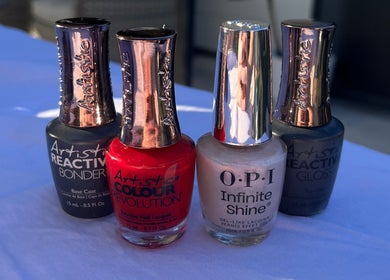 Colorful nail polishes at browNlashbyash, Robina, Queensland, AU, showcasing diverse shades.