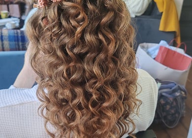 Elegant curly hairstyle at Faces of Angels salon, Hartlepool, England, GB.