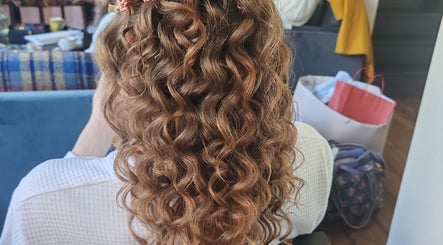 Elegant curly hairstyle at Faces of Angels salon, Hartlepool, England, GB.