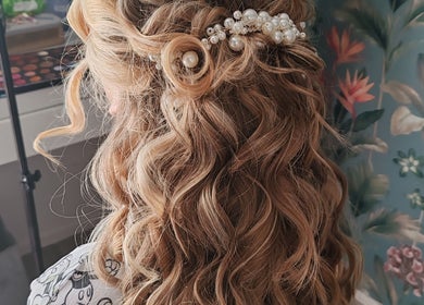 Elegant curls hairstyle at Faces of Angels in Hartlepool, England, GB. Perfect for special occasions.