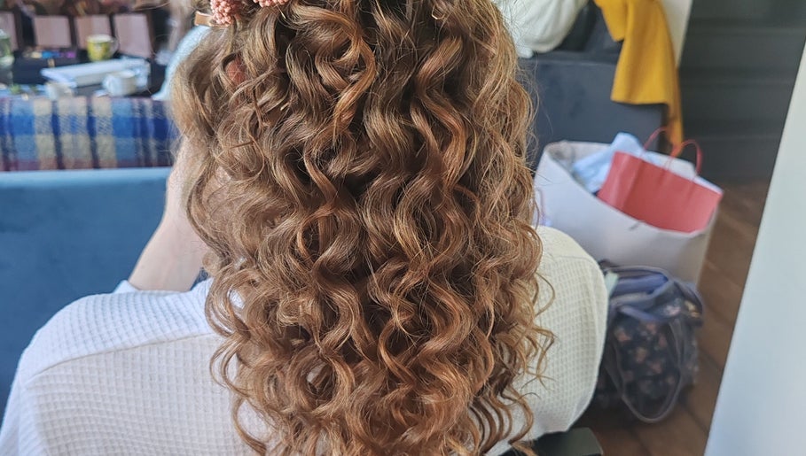Elegant curled hairstyle at Faces of Angels, Hartlepool, England, GB, showcasing professional hair design.