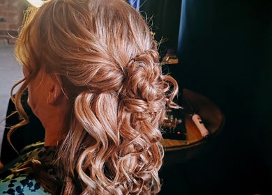 Intricate curled hairstyle at Faces of Angels, Hartlepool, England, GB, ideal for elegant occasions.