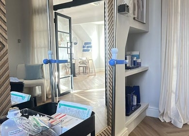 Bright interior of Rebecca Slane Skin, Alderley Edge, England, GB featuring a stylish treatment room.