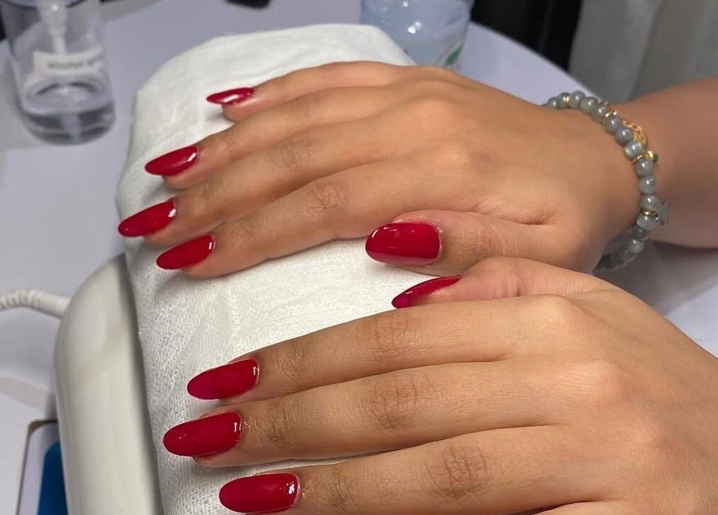 Fresh red manicure at Glamorous Salon جلامورس صالون, Riyadh, SA showcasing elegant nail art.