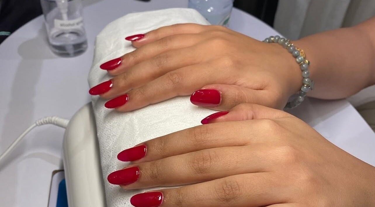 Fresh red manicure at Glamorous Salon جلامورس صالون, Riyadh, SA showcasing elegant nail art.