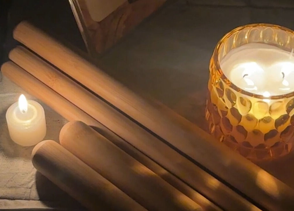 Relaxing ambiance at Glamorous Salon جلامورس صالون in Riyadh, SA with candles and massage tools.