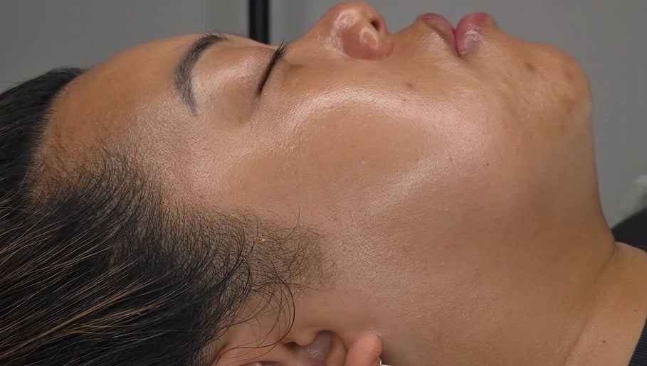 Facial treatment at Luxe Skin Studio in Derby, England, GB, highlighting glowing skin and relaxation.