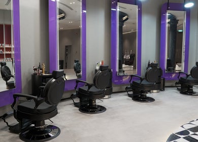Modern barber chairs and mirrors at Al Alami Barbershop العالمي, Jeddah, Makkah Province, SA.