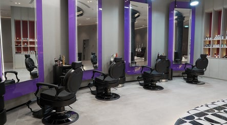 Modern barber chairs and mirrors at Al Alami Barbershop العالمي, Jeddah, Makkah Province, SA.
