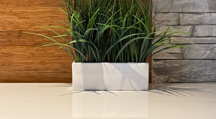 Elegant plant decor at La maison Mira, Blainville, Québec, CA enhances the peaceful ambiance.