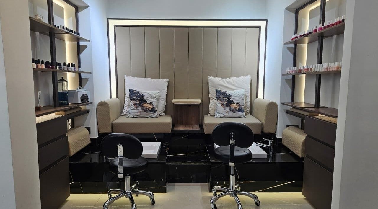 Luxurious nail service area at Mia Dolce Beauty Salon, Dubai, Dubai, AE, with chic seating and nail polish display.
