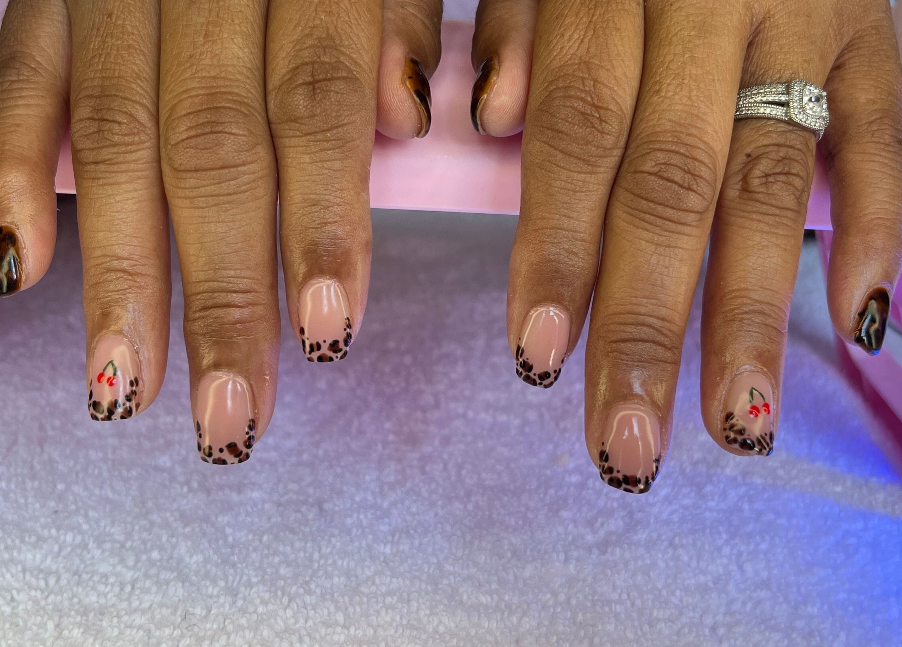 Stylish leopard nail art at Nailed by Nay, Cape Town, Western Cape, ZA. Stunning design on well-groomed nails.