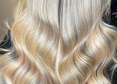 Blonde, wavy hair styled at Colours by Courts salon, Glasgow, Scotland, GB.