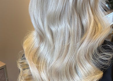 Luxurious blonde hair styled in soft waves at Colours by Courts, Glasgow, Scotland, GB.