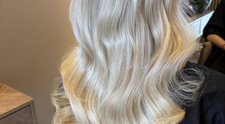 Luxurious blonde hair styled in soft waves at Colours by Courts, Glasgow, Scotland, GB.