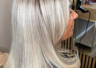 Blonde hair styled perfectly at Colours by Courts, Glasgow, Scotland, GB, reflecting sleek and vibrant shine.