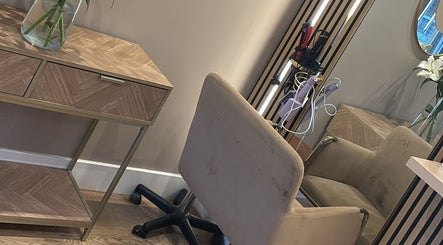 Sophisticated beauty station at Colours by Courts, Glasgow, Scotland. Features luxe chair and sleek styling tools.