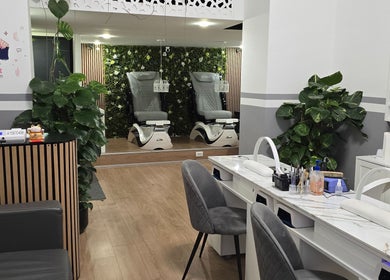 Chic interior of ANNA BEAUTY NAILS & EYELASHES, Budapest, Magyar, HU featuring stylish nail and pedicure stations.