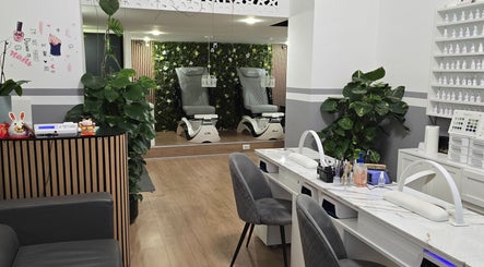 Chic interior of ANNA BEAUTY NAILS & EYELASHES, Budapest, Magyar, HU featuring stylish nail and pedicure stations.