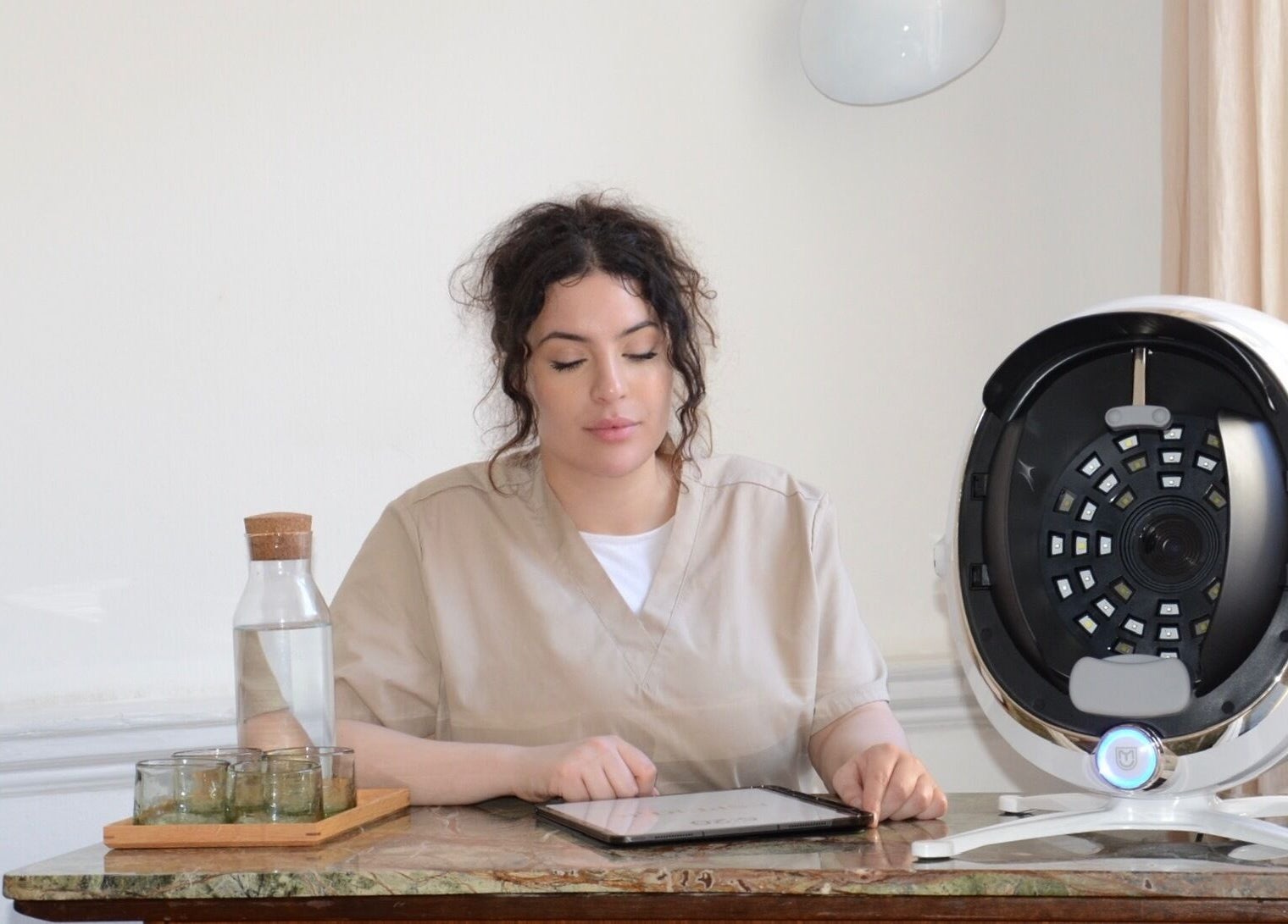 Professional at ESPÉRER PSYCHODERMATOLOGY CLINIC in London, England, GB, conducting a dermatology consultation.