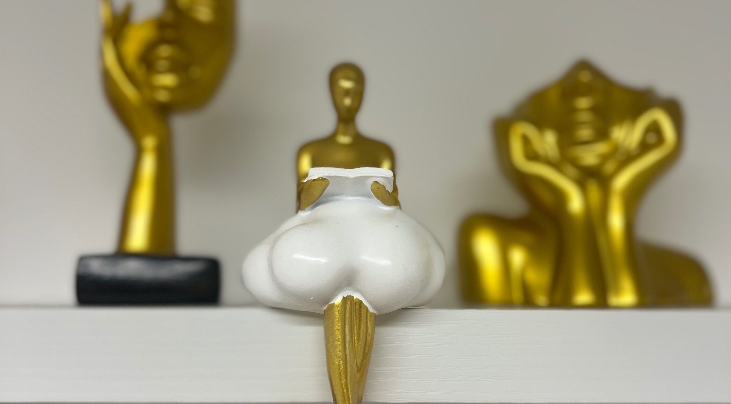 Artistic gold and white sculptures at My beauty room 22, London, England, GB enhance ambiance.